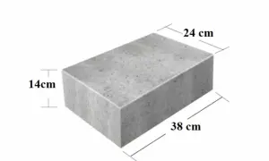 Szary bloczek betonowy o wymiarach 38x24x14 cm. Zastanawiasz się, ile waży bloczek betonowy?