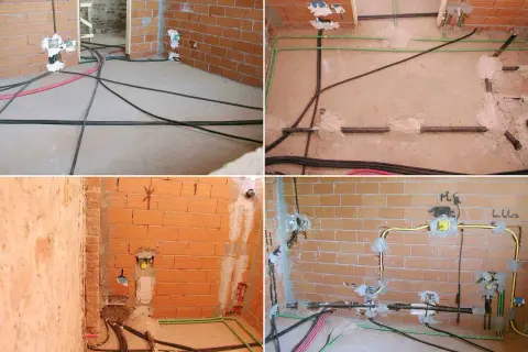 Budowa domu w toku: instalacje elektryczne i hydrauliczne, w tym rury **propanu**, czekają na wykończenie.